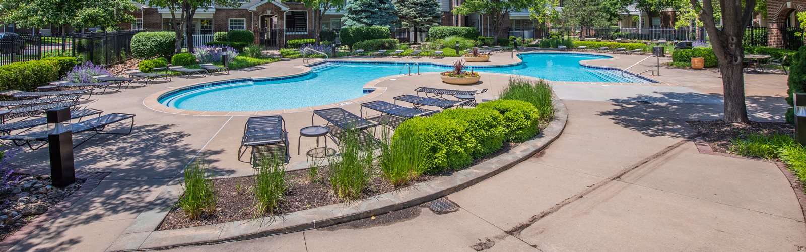 Lush green with pool view at Creekside Apartments, Kansas