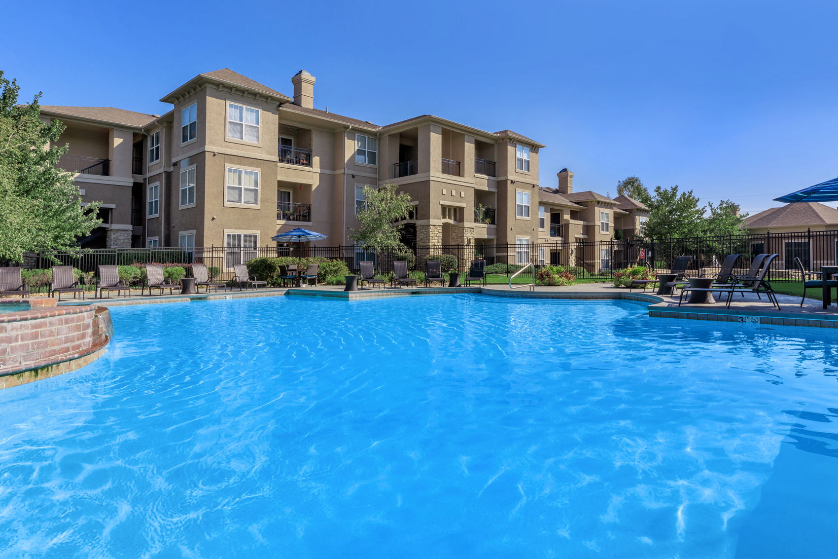Pool with apartment in background at Stonepost Lakeside, Olathe, KS, 66062