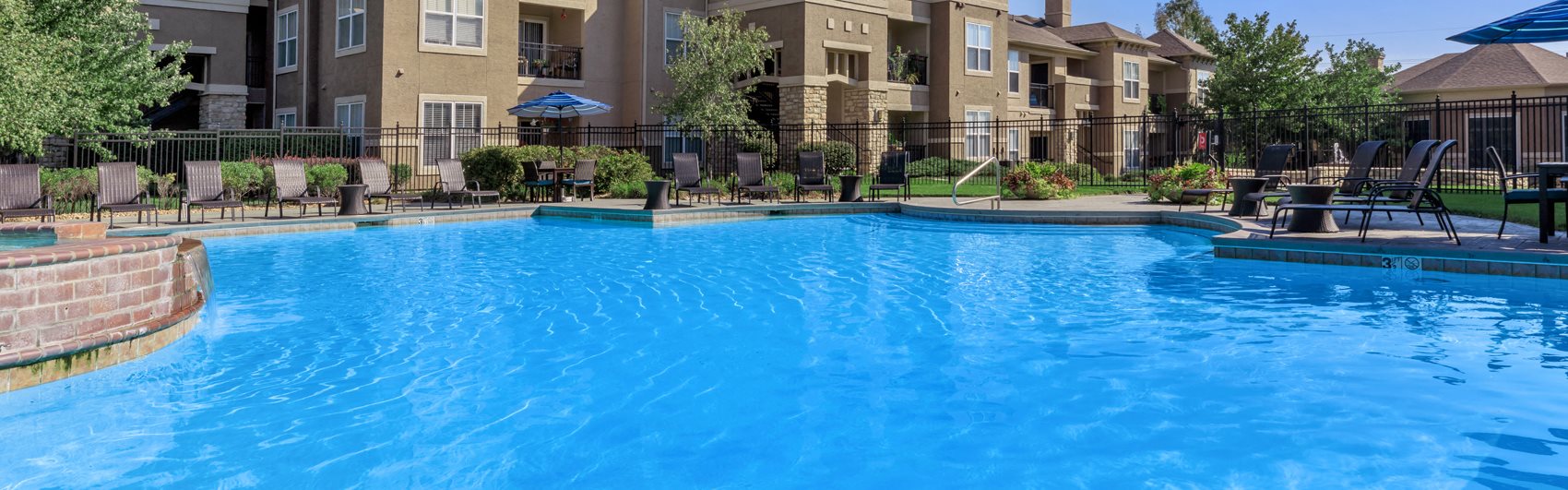 Pool with apartment in background at Stonepost Lakeside, Olathe, KS, 66062